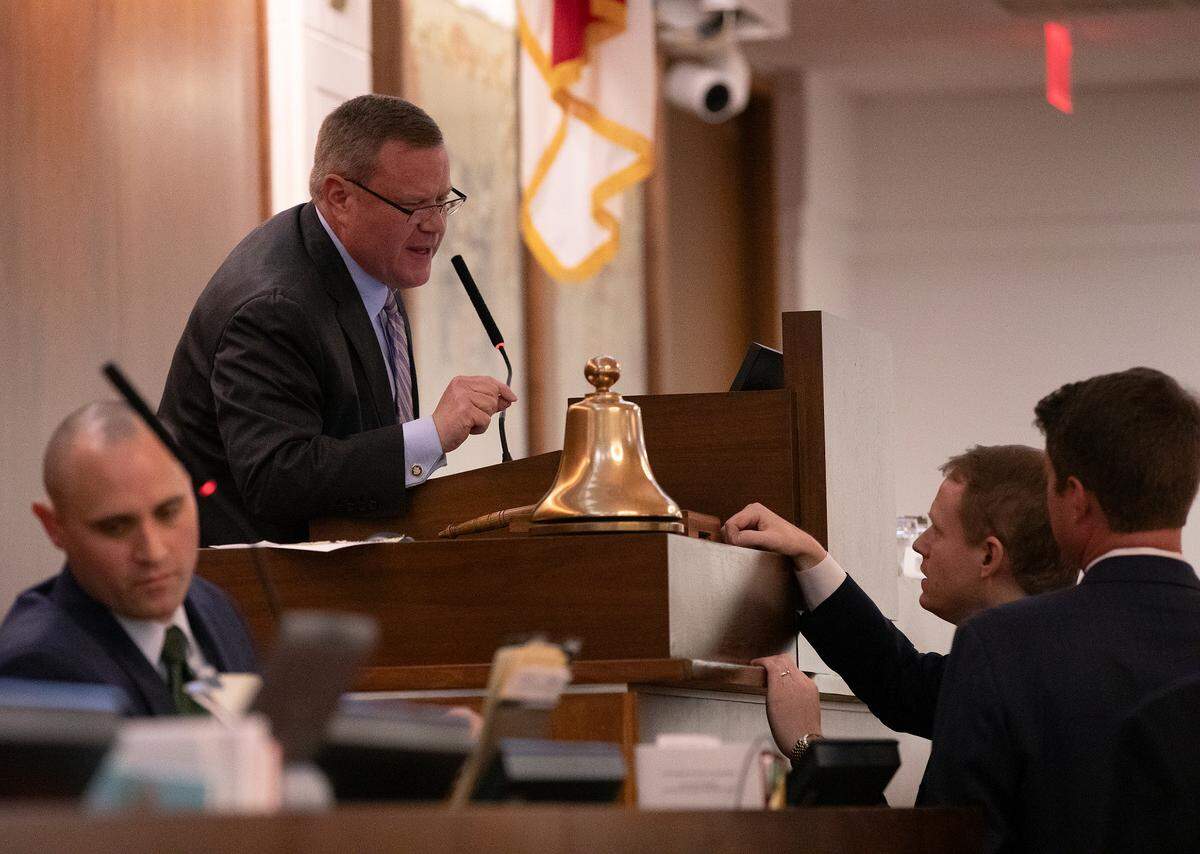 North Carolina House Speaker Tim Moore talks with Rep. Destin Hall during the legislative session on Tuesday, Nov. 19, 2024, in Raleigh, N.C.