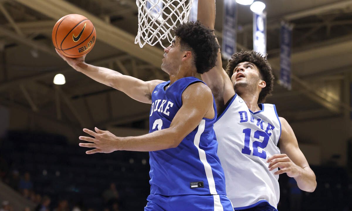 Duke’s Cayden Boozer (2) heads to the basket past twin Cameron Boozer (12) during the Blue Devils’ open practice at Cameron Indoor Stadium in Durham, N.C., Tuesday, August 5, 2025.