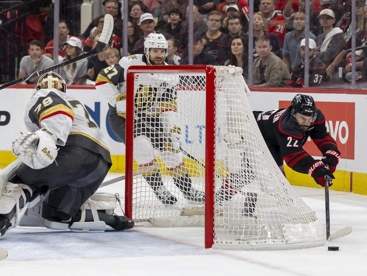Carolina Hurricanes center Logan Stankoven (22) moves the puck behind Vegas goalie Carter Hart (79) in the first period in Game 2 of the Stanley Cup Final, on Thursday, June 4, 2026 at Lenovo Center in Raleigh, N.C.