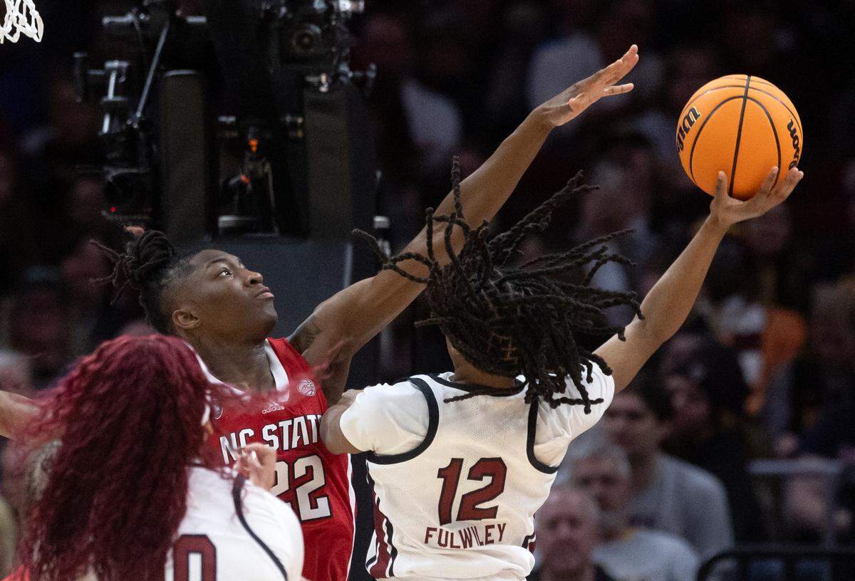 South Carolina’s MiLaysia Fulwiley shoots over N.C. State’s Saniya Rivers during the second half of the Wolfpack’s 78-59 Final Four loss at Rocket Mortgage FieldHouse on Friday, April 5, 2024, in Cleveland, Ohio.