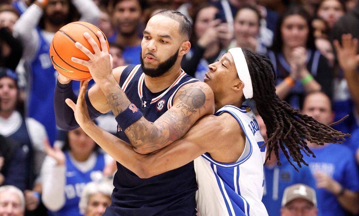 Duke’s Maliq Brown (6) defends Auburn’s Johni Broome (4) during the first half of Duke’s game against Auburn at Cameron Indoor Stadium in Durham, N.C., Wednesday, Dec. 4, 2024.
