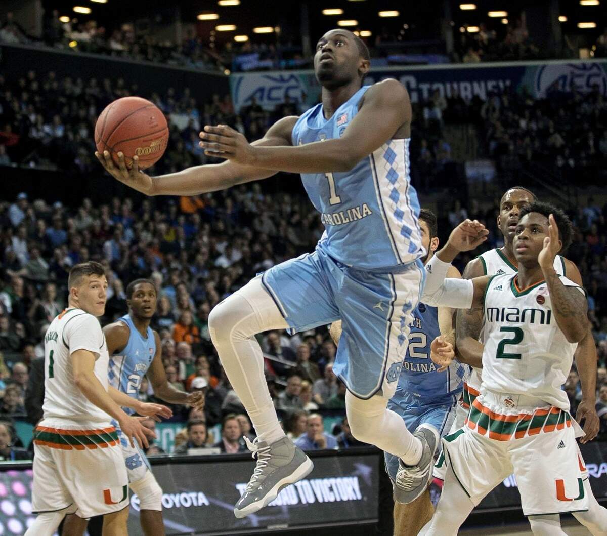 North Carolina's Theo Pinson (1) drives past Miamiís Chris Lykes (2) in the first half of the quarterfinals of the ACC Tournament on Thursday, March 8, 2018 at the Barclays Center in Brooklyn, NY.
