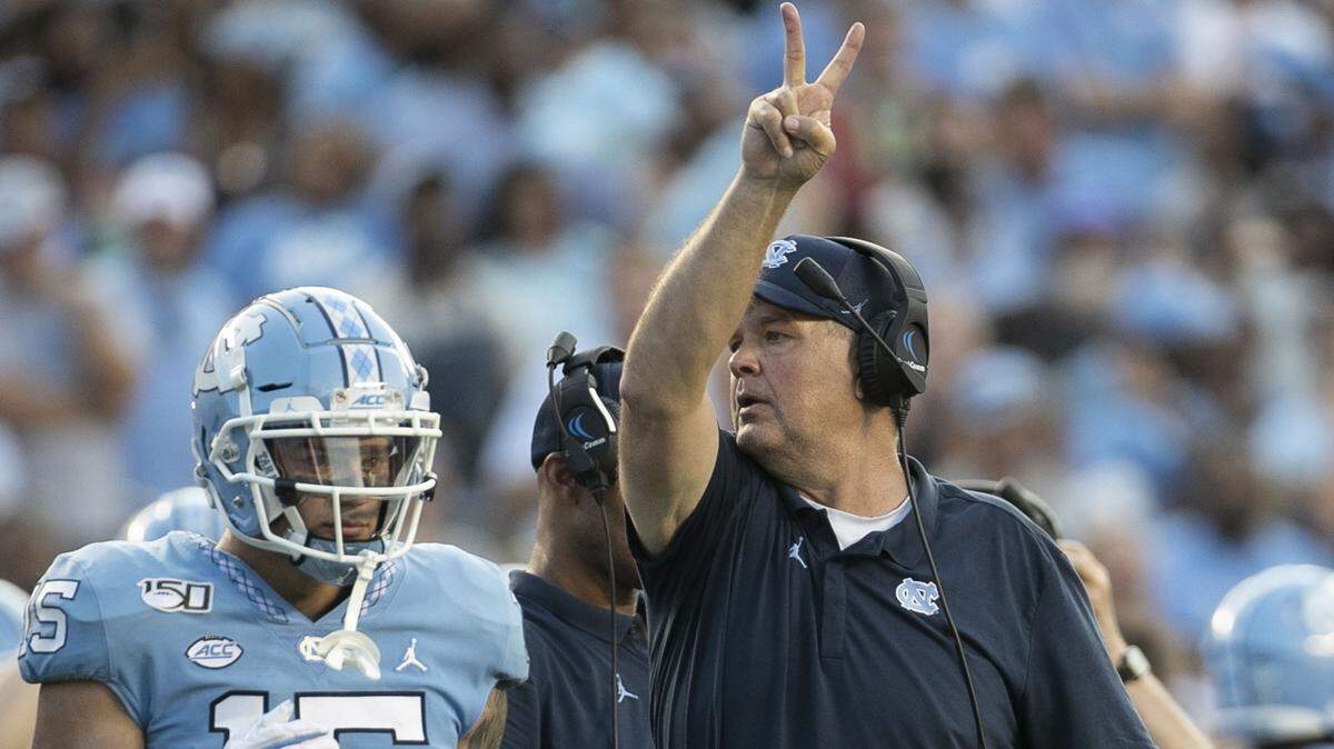 North Carolina offensive line catch Stacy Searels calls for a two-point conversation after the Tar Heels’ touchdown in the fourth quarter against No. 1 Clemson on Saturday, September 28, 2019, at Kenan Stadium in Chapel Hill, N.C. The attempt fell short, and Clemson secured a 21-20 victory.