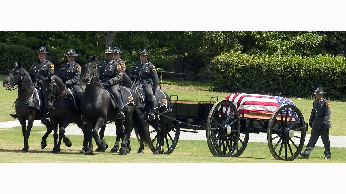 N.C. State Highway Patrol troopers pull the casket of former Trooper A.J. Stocks outside Colonial Baptist Church in Cary for his funeral processional on Sept. 13, 2008. Stocks died when his patrol car collided with a garbage truck four days earlier.