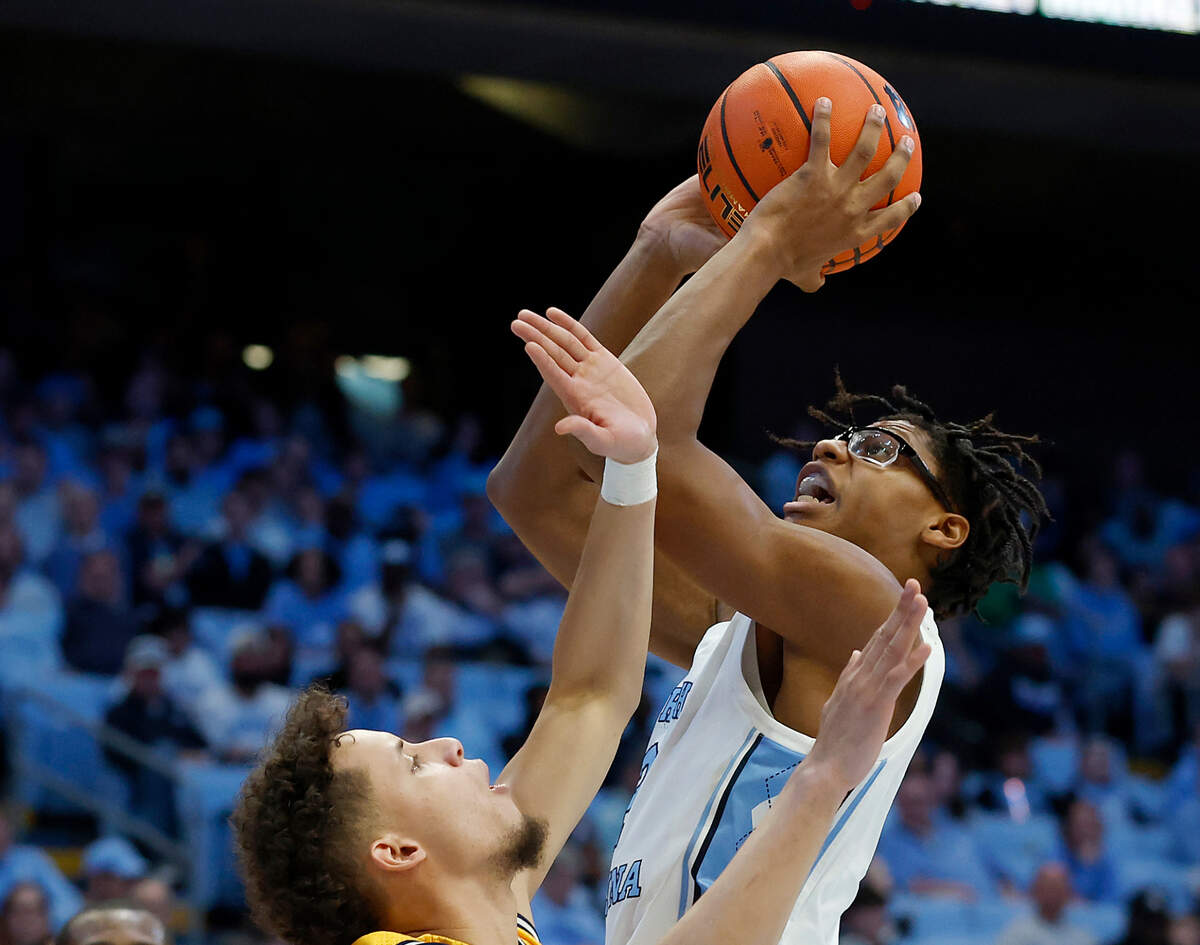 North Carolina’s James Brown shoots over La Salle’s Andrés Marrero during the second half of the Tar Heels’ 93-67 win on Saturday, Dec. 14, 2024, at the Smith Center in Chapel Hill, N.C.