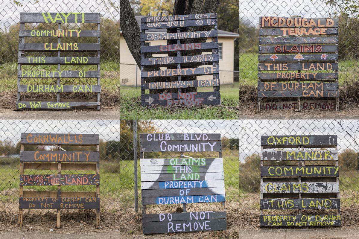 Pallets painted with the names several communities within Durham, N.C. sit on Grant St. in the historic Hayti District outside of what used to be Fayette Place, a housing development that was demolished in 2009. The empty lot has yet to be repurposed and some residents feel this symbolizes the city’s disinvestment in African-American neighborhoods. Durham CAN, a community organization aimed at lifting up the voices of residents who are often ignored, created and placed the pallets.