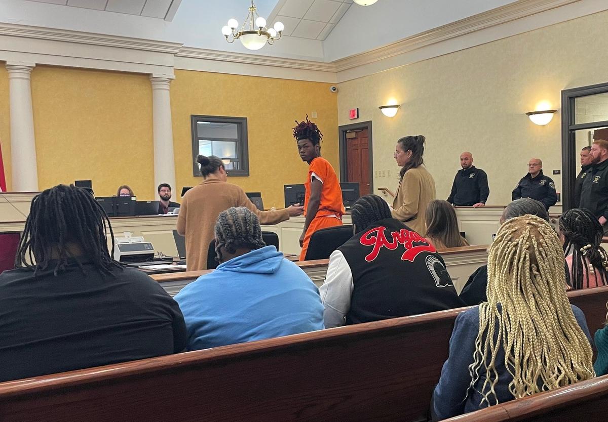 Kenyon Cameron, 19, turns to look at his family and friends in the front row of an Orange County courtroom in Hillsborough before a brief hearing Thursday, Jan. 16, 2025. Cameron is charged with two counts of murder.