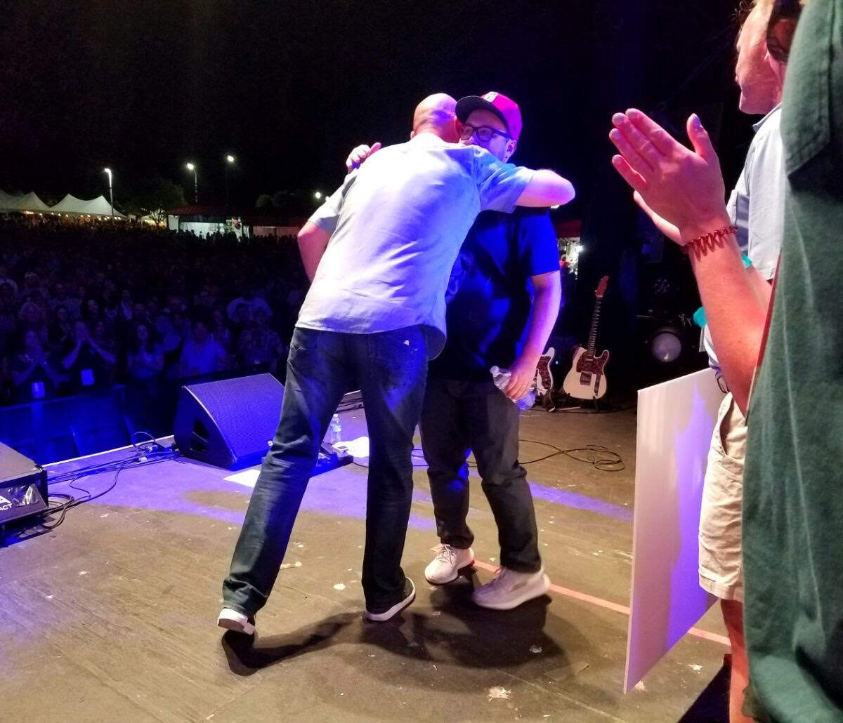 Thorne Daubenspeck, executive director of Band Together NC, and St. Paul & The Broken Bones lead singer Paul Janeway at Red Hat Amphitheater June 1. Due to health reasons, Janeway was unable to perform with his band.