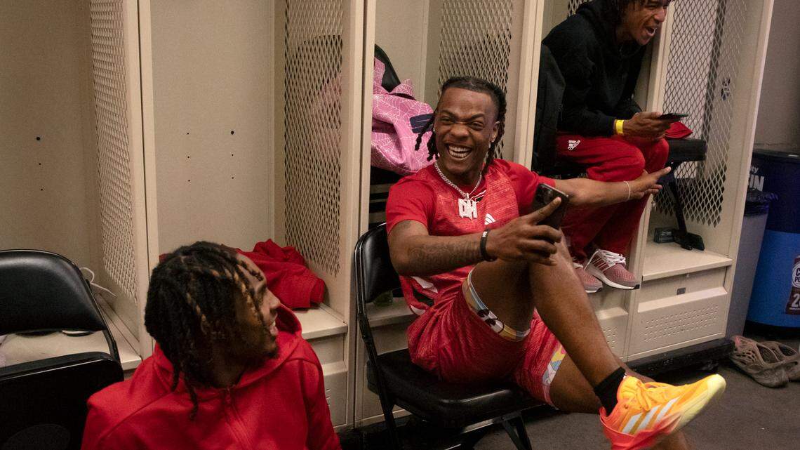 N.C. State’s DJ Horne, center, shares a laugh with Kam Woods, left, prior to practice on Wednesday, March 20, 2024, at PPG Paints Arena in Pittsburgh, Pa. The Wolfpack face sixth-seeded Texas Tech in the first round of the NCAA Tournament on Thursday.