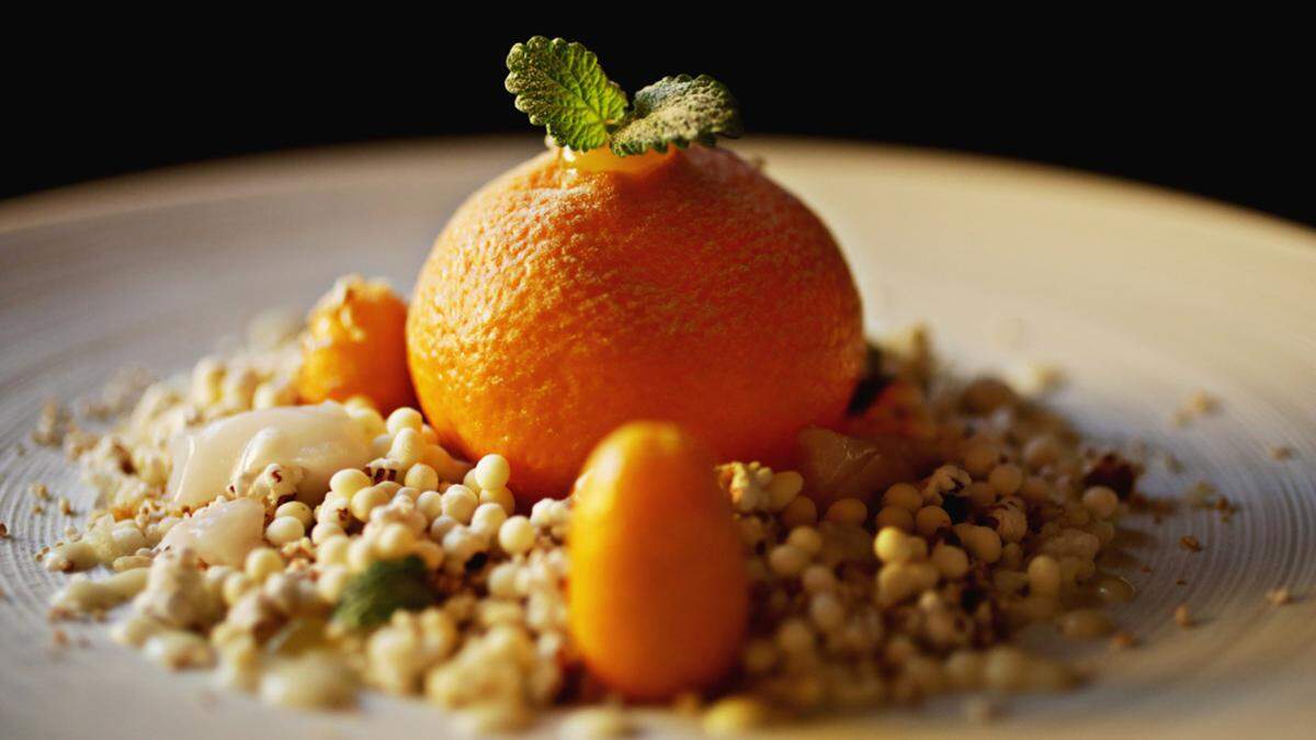 This chicken liver dish with creme fraiche and lemon balm from Herons’ is served inside citrus atop a bed of puffed grains.