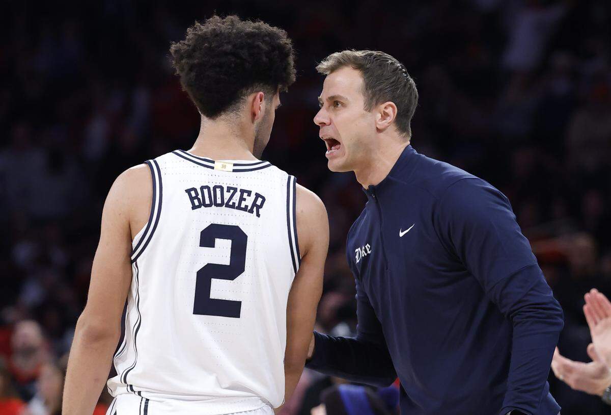 Duke head coach Jon Scheyer talks to Cayden Boozer (2) during the second half of Texas Tech’s 82-81 victory over Duke in the SentinelOne Classic at Madison Square Garden in New York City, N.Y., Saturday, Dec. 20, 2025.
