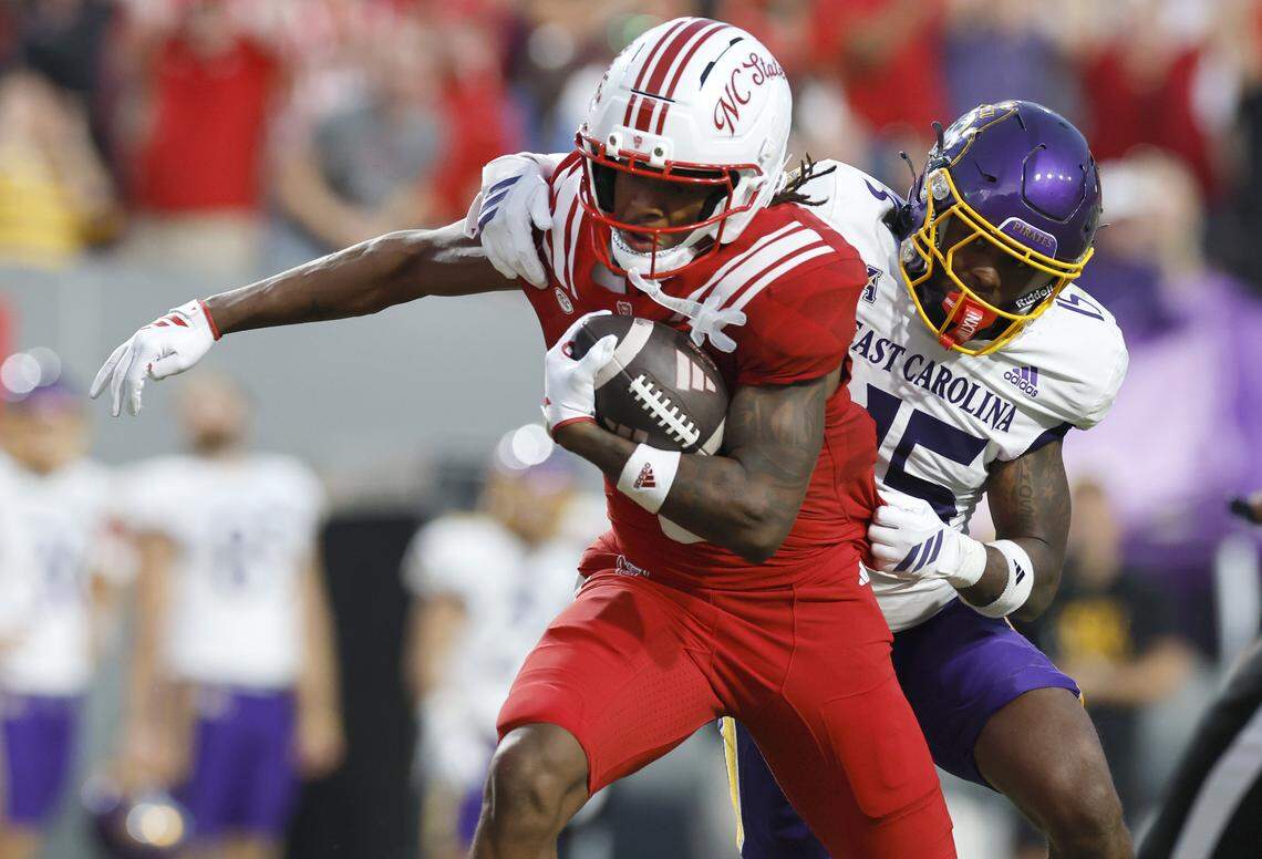 N.C. State wide receiver Wesley Grimes (6) breaks away from East Carolina defensive back Jordy Lowery (15) to score on a 48-yard touchdown reception during the first half of N.C. State’s game against ECU at Carter-Finley Stadium in Raleigh, N.C., Thursday, August 28, 2025.