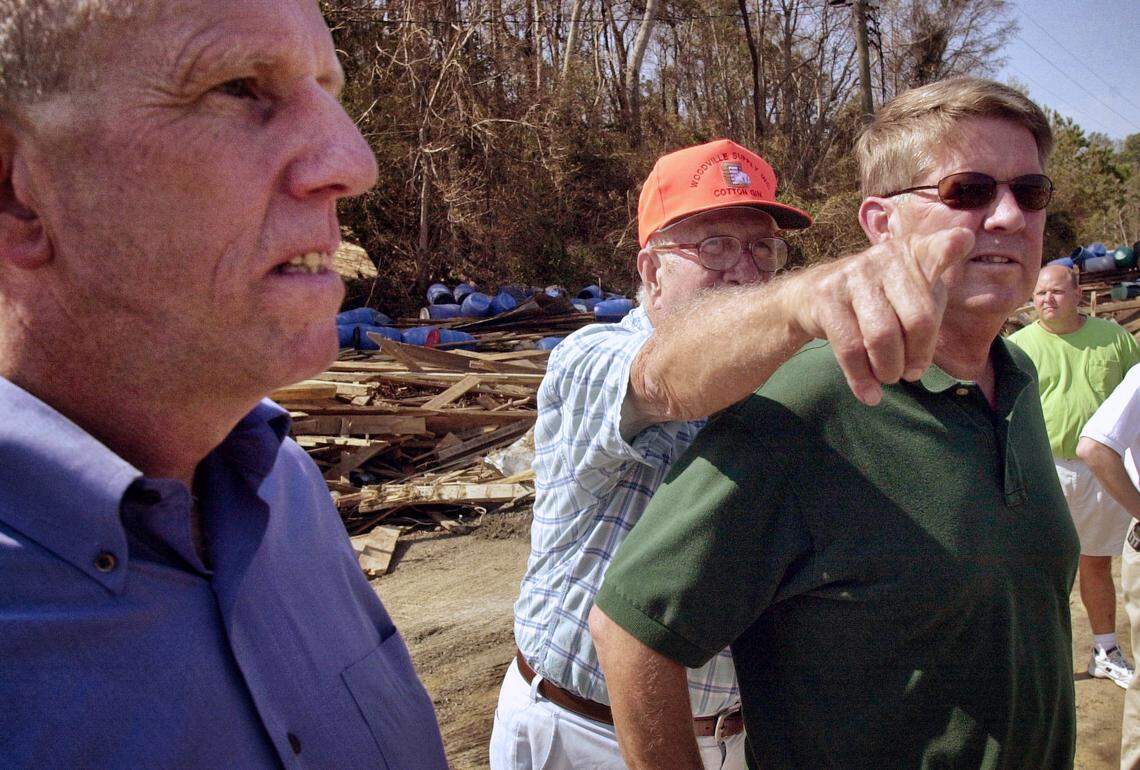 Norman Perry, center, shows senator Marc Basnight, right, and Bill Ross, Secretary of the Department of Natural Resources, some of the extensive damage to the Perry Wynns Fish Company Thursday, Sept 25, 2003 in Colerain.