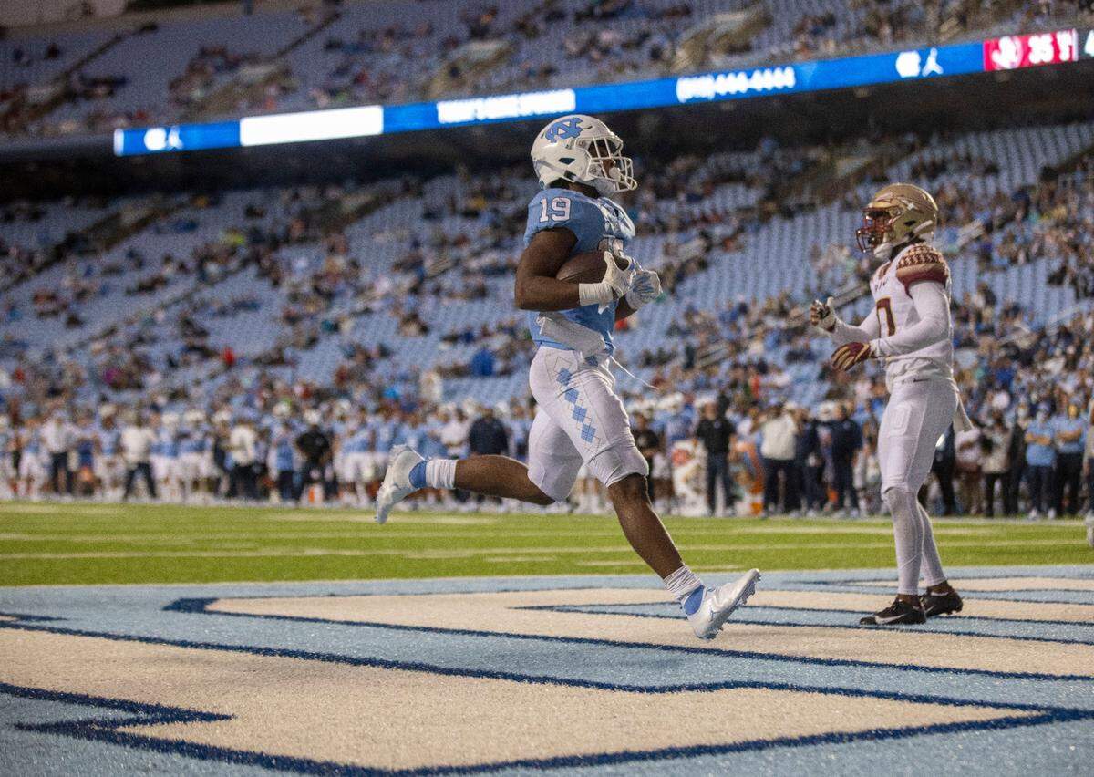 North Carolina running back Ty Chandler (19) scores on a two-yard run in the fourth quarter against Florida State on Saturday, October 9, 2021at Kenan Stadium in Chapel Hill, N.C.