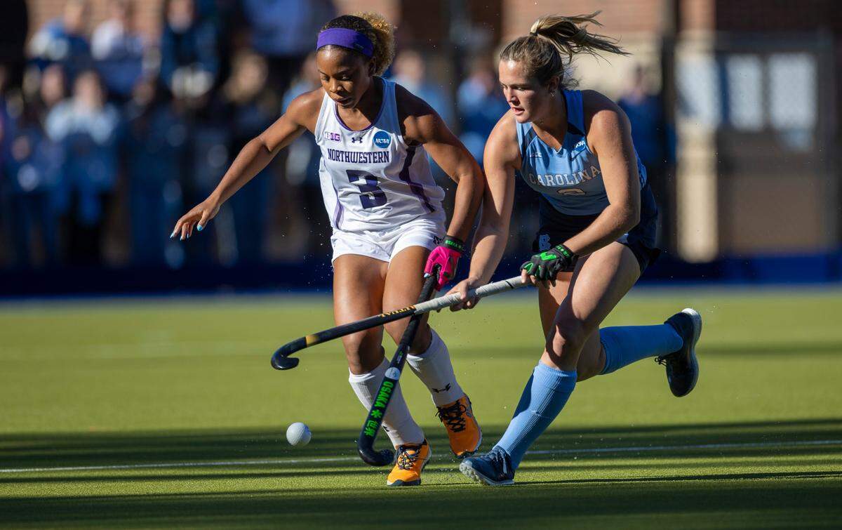 North Carolina’s Charly Bruner (2) and Northwestern’s Olivia Bent-Cole (3) battle for control of the ball in the first quarter during the NCAA Division I Field Hockey Championship game on Sunday, November 19, 20223 at Karen Shelton Stadium in Chapel Hill, N.C.