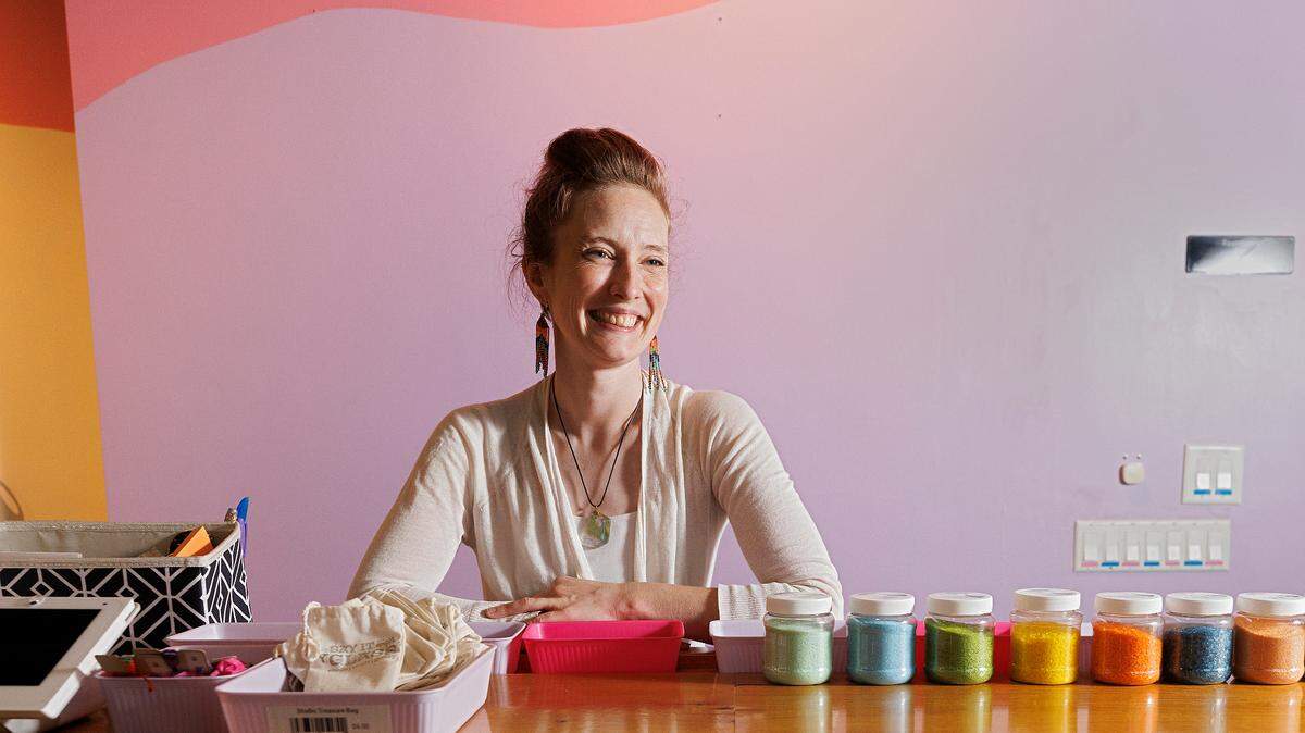 Sam Nguyen, owner of Say It With Glass, is photographed at her business in Carrboro, N.C. on Thursday, Nov. 7, 2024. Say It With Glass offers classes, kids camps, studio memberships and art for sale.