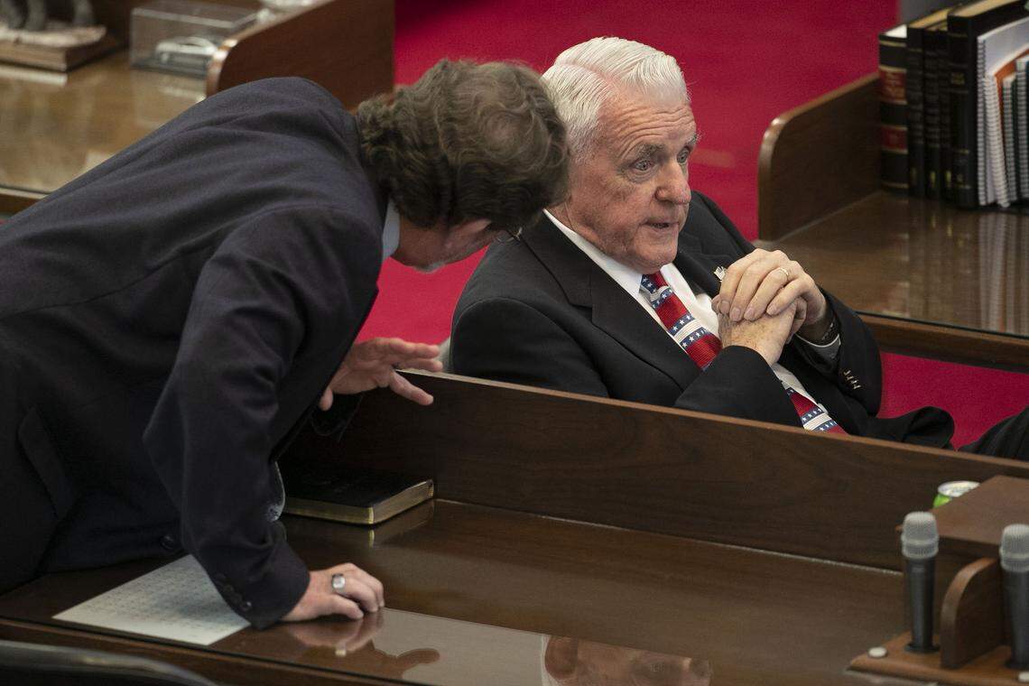 Rep. George Cleveland of Jacksonville, N.C., right, talks with Rep.Rep. Larry Pittman of Concord, N.C. during the General Assembly session on Tuesday, April 28, 2020 in Raleigh, N.C.