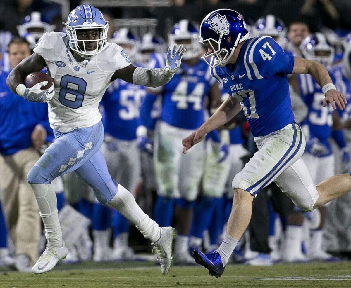 North Carolina’s T.J. Logan (8) returns a kick off 75 yards in the third quarter before being stopped by Duke’s Will Kline (47) on Thursday, November 10, 2016 at Wallace Wade Stadium in Durham, N.C.