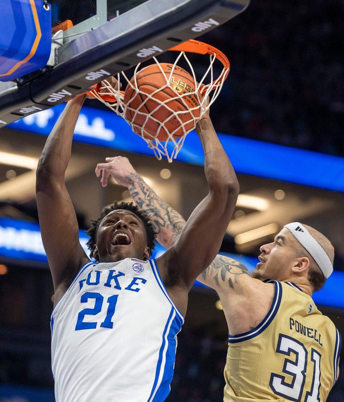 Duke’s Patrick Ngongba II (21) gets a dunk against Georgia Tech’s Duncan Powell (31) in the first half against Georgia Tech on Thursday, March 13, 2025 during the quarterfinals of the ACC Tournament at Spectrum Center in Charlotte, N.C.