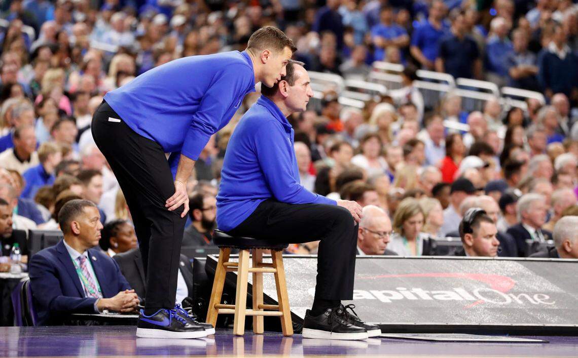 Duke associate head coach Jon Scheyer talks with head coach Mike Krzyzewski during the second half of UNCs 81-77 victory over Duke in the Final Four at Caesars Superdome in New Orleans, La., Saturday, April 2, 2022.