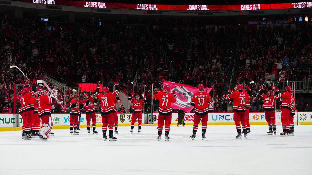 Jan 11, 2024; Raleigh, North Carolina, USA; Carolina Hurricanes players celebrate their victory against the Anaheim Ducks at PNC Arena. Mandatory Credit: James Guillory-USA TODAY Sports