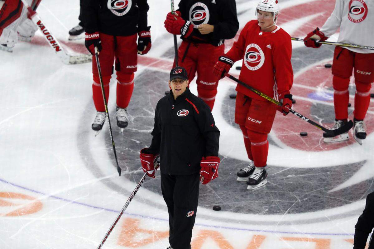 Carolina head coach Rod Brind’Amour talks with the team during the Carolina Hurricanes’ on-ice workouts at PNC Arena in Raleigh, N.C., Monday, July 13, 2020.
