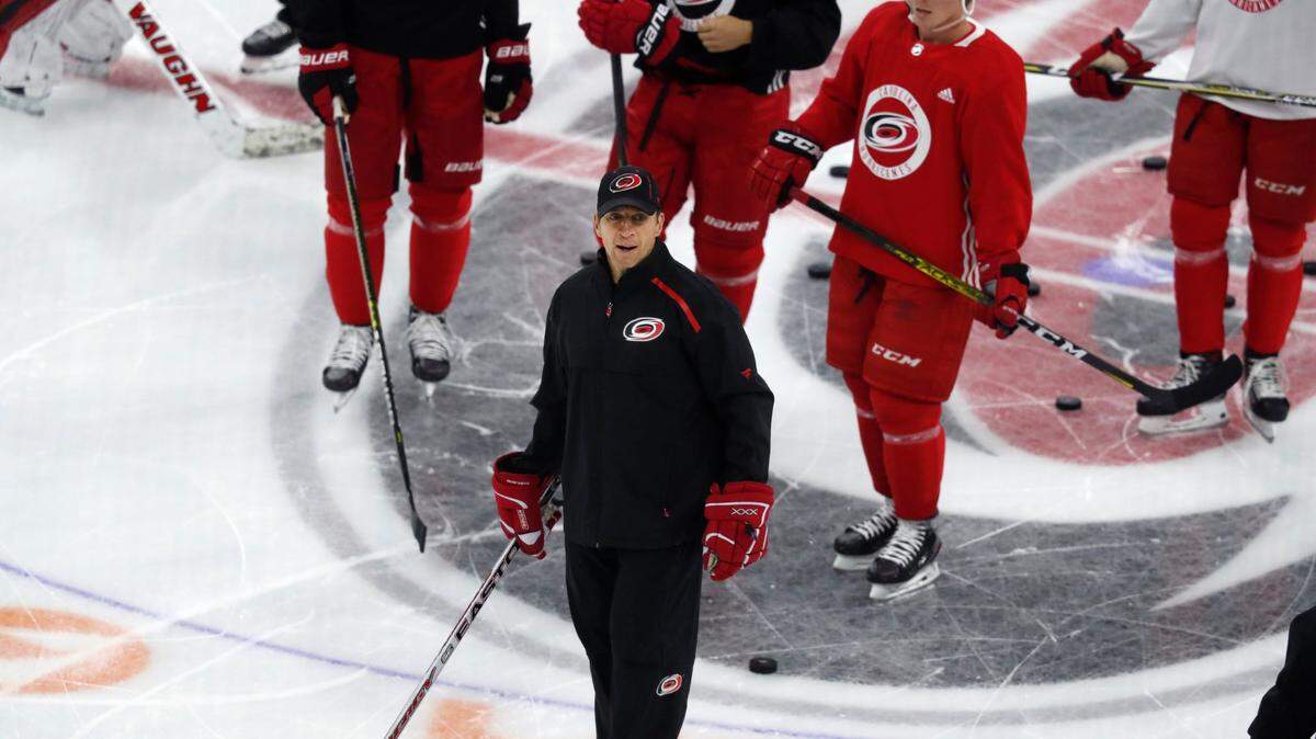 Carolina head coach Rod Brind’Amour talks with the team during the Carolina Hurricanes’ on-ice workouts at PNC Arena in Raleigh, N.C., Monday, July 13, 2020.