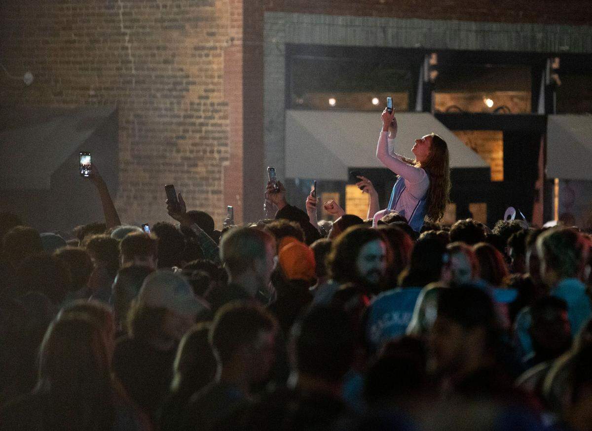Tar Heel fans celebrated in the streets of downtown Chapel Hill, N.C. after a historic Final Four win against their rival, Duke, on Saturday, April 2, 2022.
