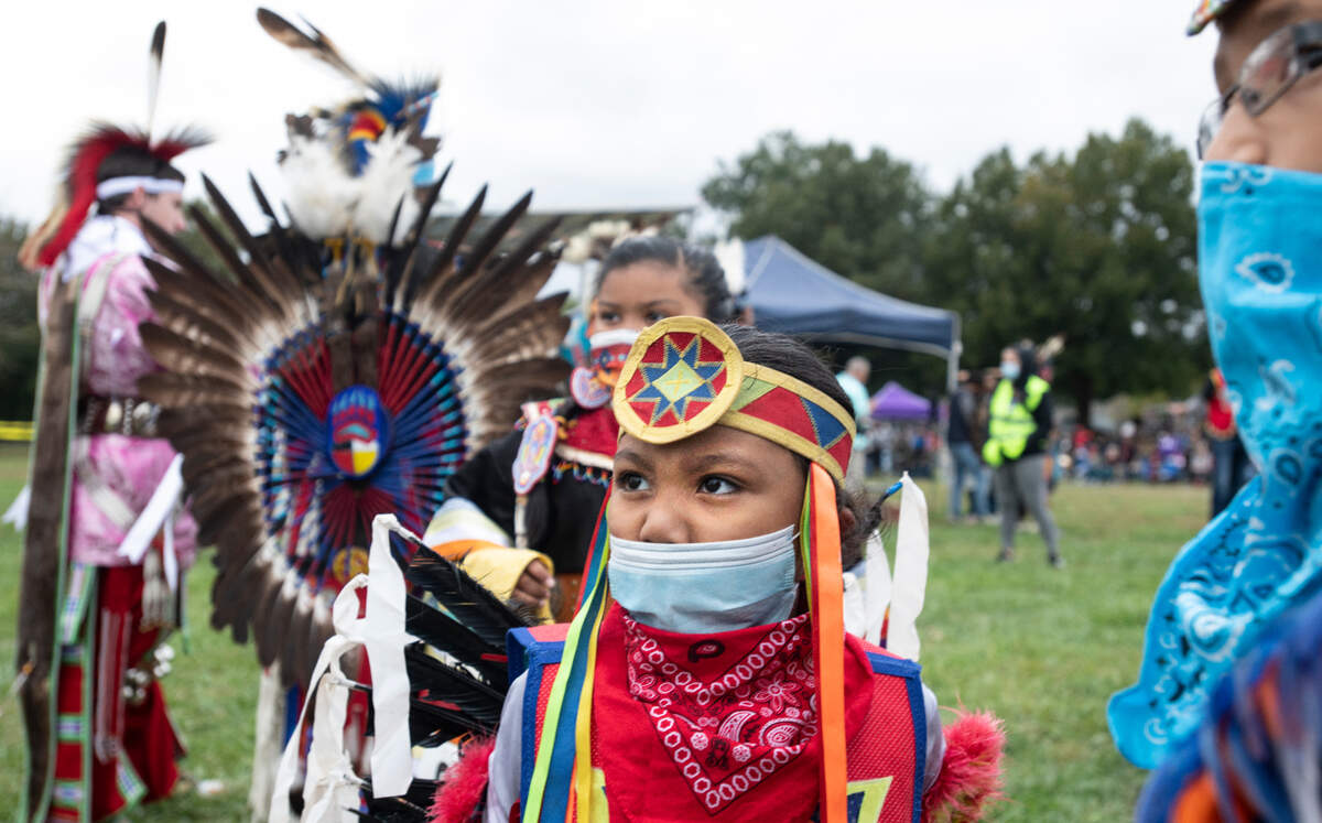 Young dancers wait to participate in the grand entry at at the Inter-tribal Pow Wow celebrating the legacy and culture of North Carolina Indigenous communities Saturday, Oct. 30, 2021 at Raleigh’s Dix Park.