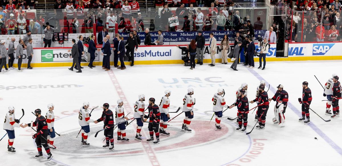 The Florida Panthers and the Carolina Hurricanes go through their handshake line after the Panthers clinched their Stanley Cup series with a 5-3 victory on Wednesday, May 28, 2025 at Lenovo Center in Raleigh, N.C.
