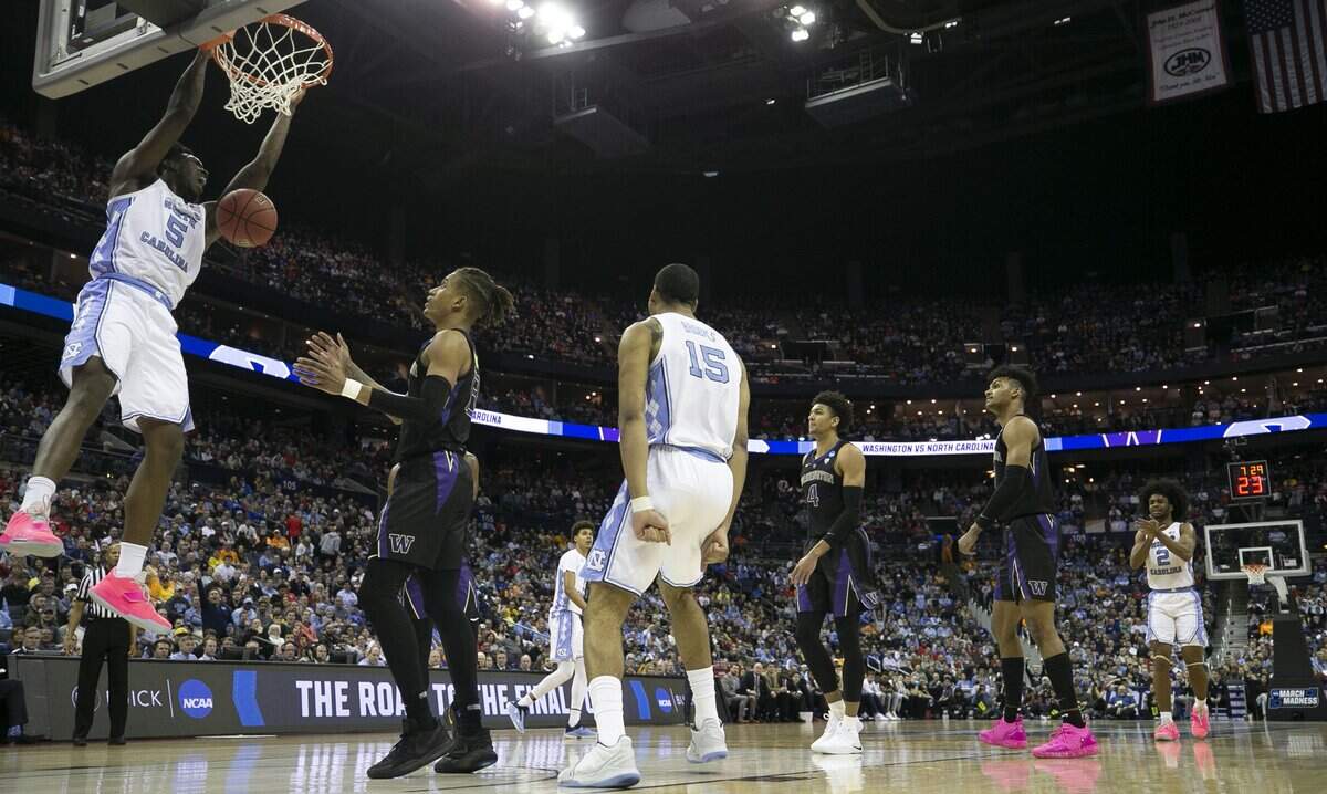 North Carolina’s Nassir Little (5) gets a dunk over over Washington’s Hameir Wright (13) during the second half in the second round of the NCAA Tournament on Sunday, March 24, 2019 at Nationwide Arena in Columbus, Ohio. Little and Luke Maye lead all scores with 20 points in the Tar Heels’ 81-59 victory.