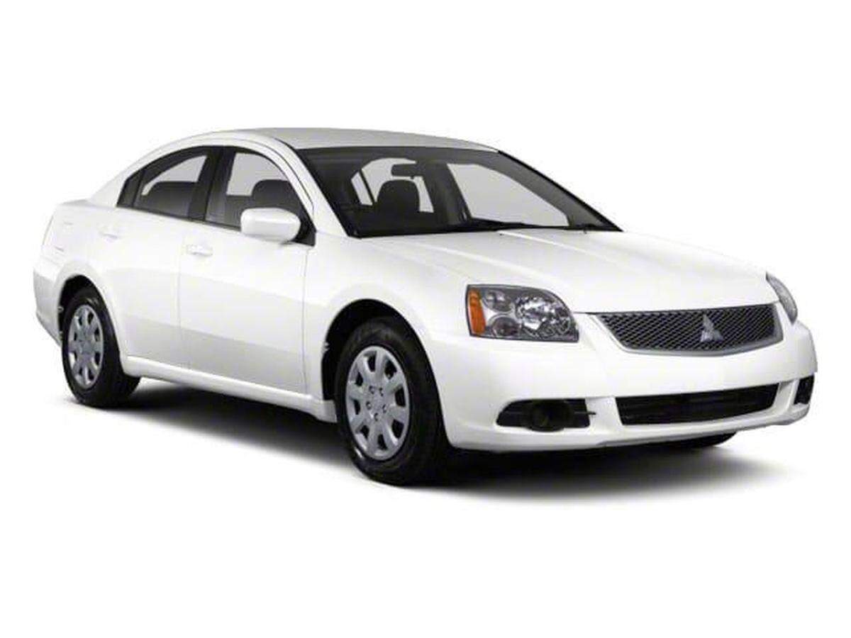 Durham police are looking for a car like this white Mitsubishi Galant that is missing its passenger side mirror and fog light.