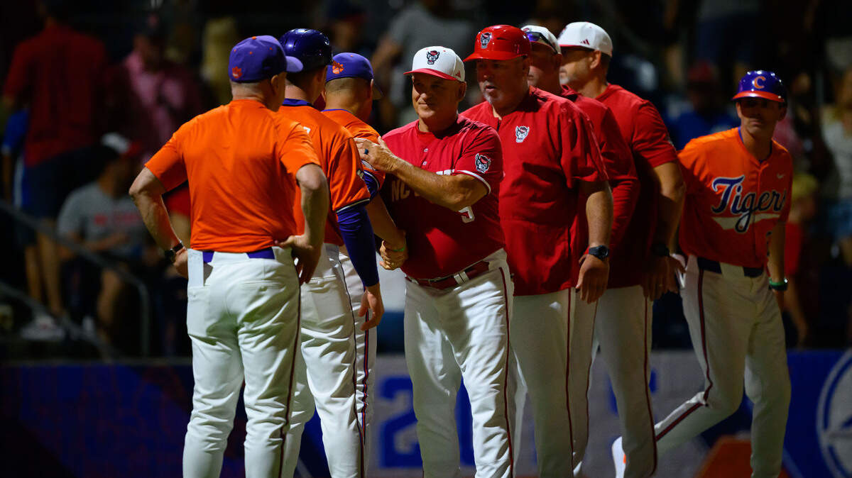 NC State coach Elliot Avent and Clemson coach Erik Bakich shake hands after the Wolfpack’s 7-6 loss to the Tigers on Thursday, May 22, 2025, in the ACC Baseball Championship at Durham Bulls Athletic Park in Durham, N.C.