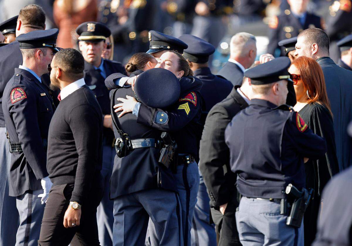 Police officers gather outside Cross Assembly Church in Raleigh, N.C., before the funeral of Raleigh Police Officer Gabriel Torres Saturday, Oct. 22, 2022.