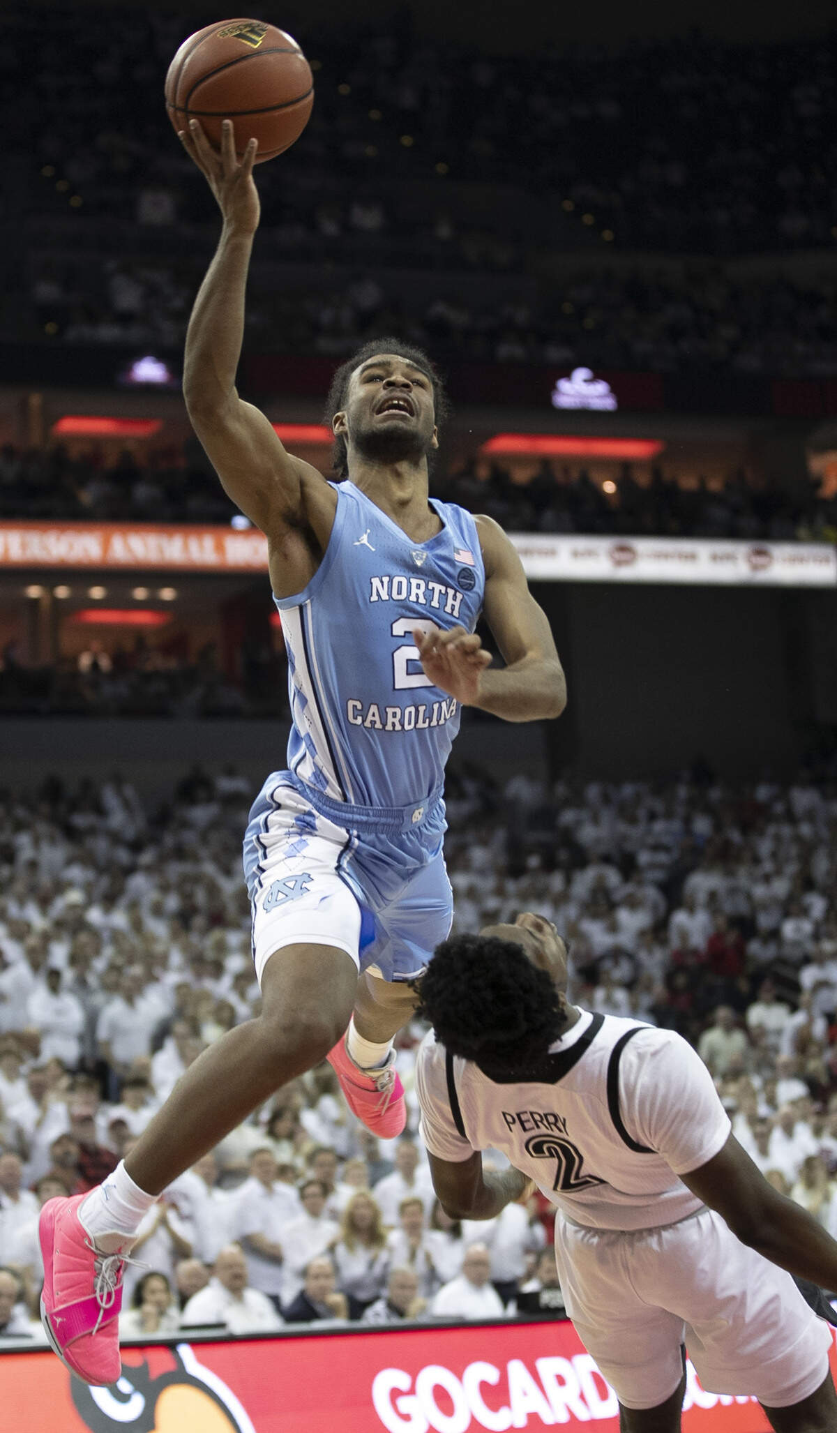 North Carolina’s Coby White (2) drives to the basket against Louisville’s Darius Perry (2) during the second half on Saturday, February 2, 2019 at the KFC Yum! Center in Louisville, Ky.
