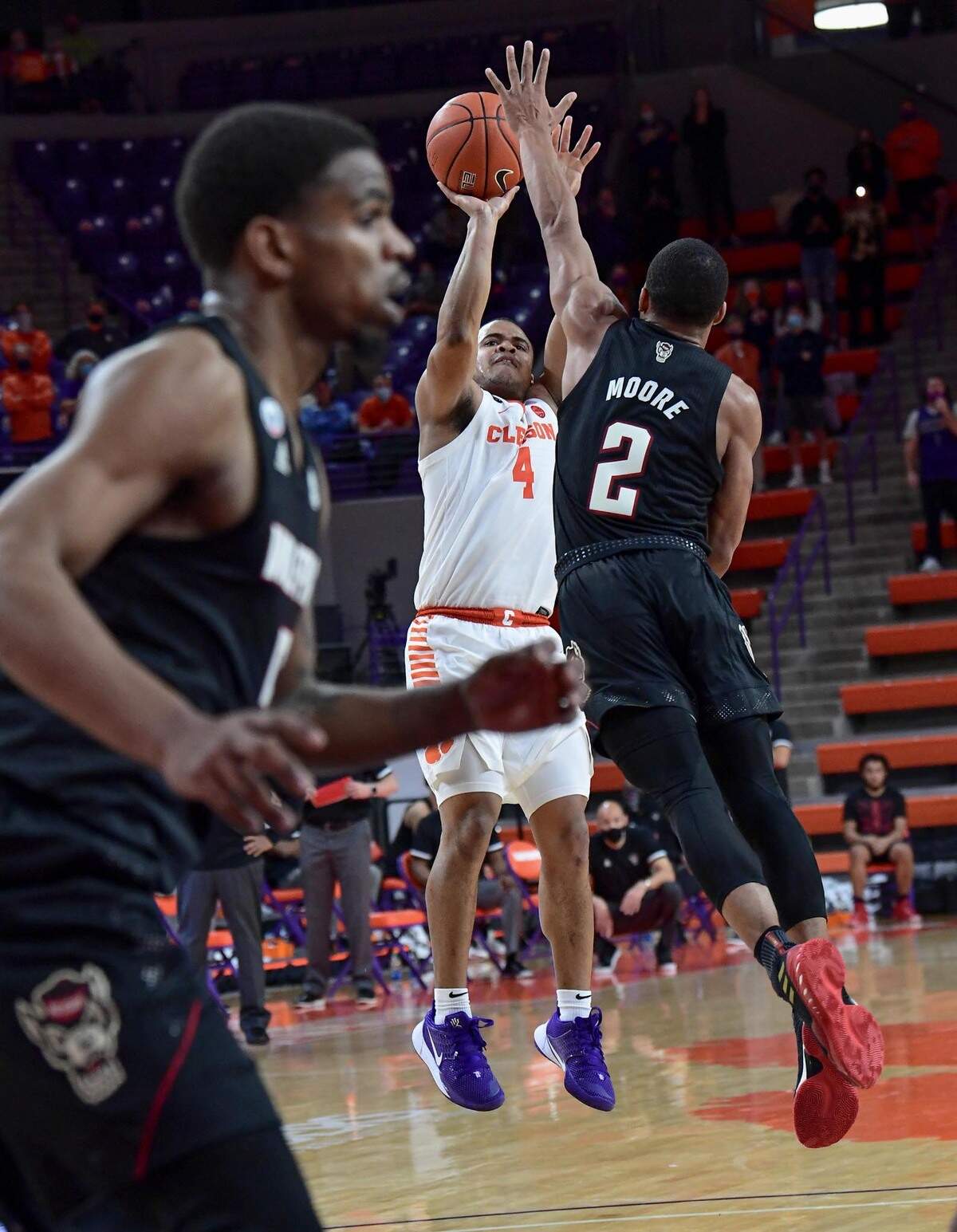 Clemson sophomore guard Nick Honor(4) unsuccessfully attempts a game-winning shot near NC State guard Shakeel Moore(2) during the second half of their game Jan 5, 2021.