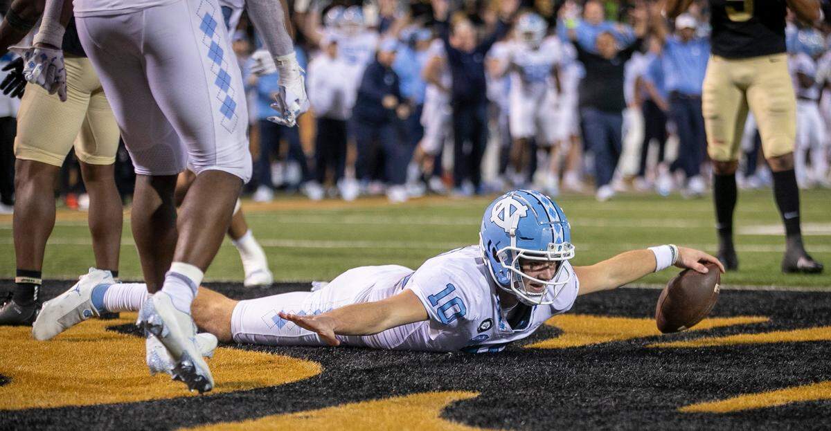 North Carolina quarterback Drake Maye (10) reacts after scoring on a five-yard run to give the Tar Heels a 33-28 lead in the third quarter against Wake Forest on Saturday, November 12, 2022 at Truist Field in Winston-Salem, N.C.
