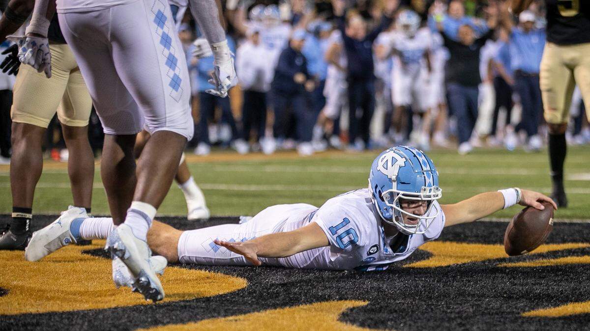North Carolina quarterback Drake Maye (10) reacts after scoring on a five-yard run to give the Tar Heels a 33-28 lead in the third quarter against Wake Forest on Saturday, November 12, 2022 at Truist Field in Winston-Salem, N.C.