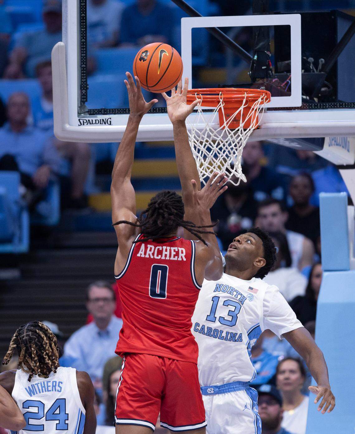 North Carolina’s Jalen Washington (13) defends Radford’s Justin Archer (0) in the second half on Monday, November 6, 2023 at the Dean Smith Center in Chapel Hill, N.C.