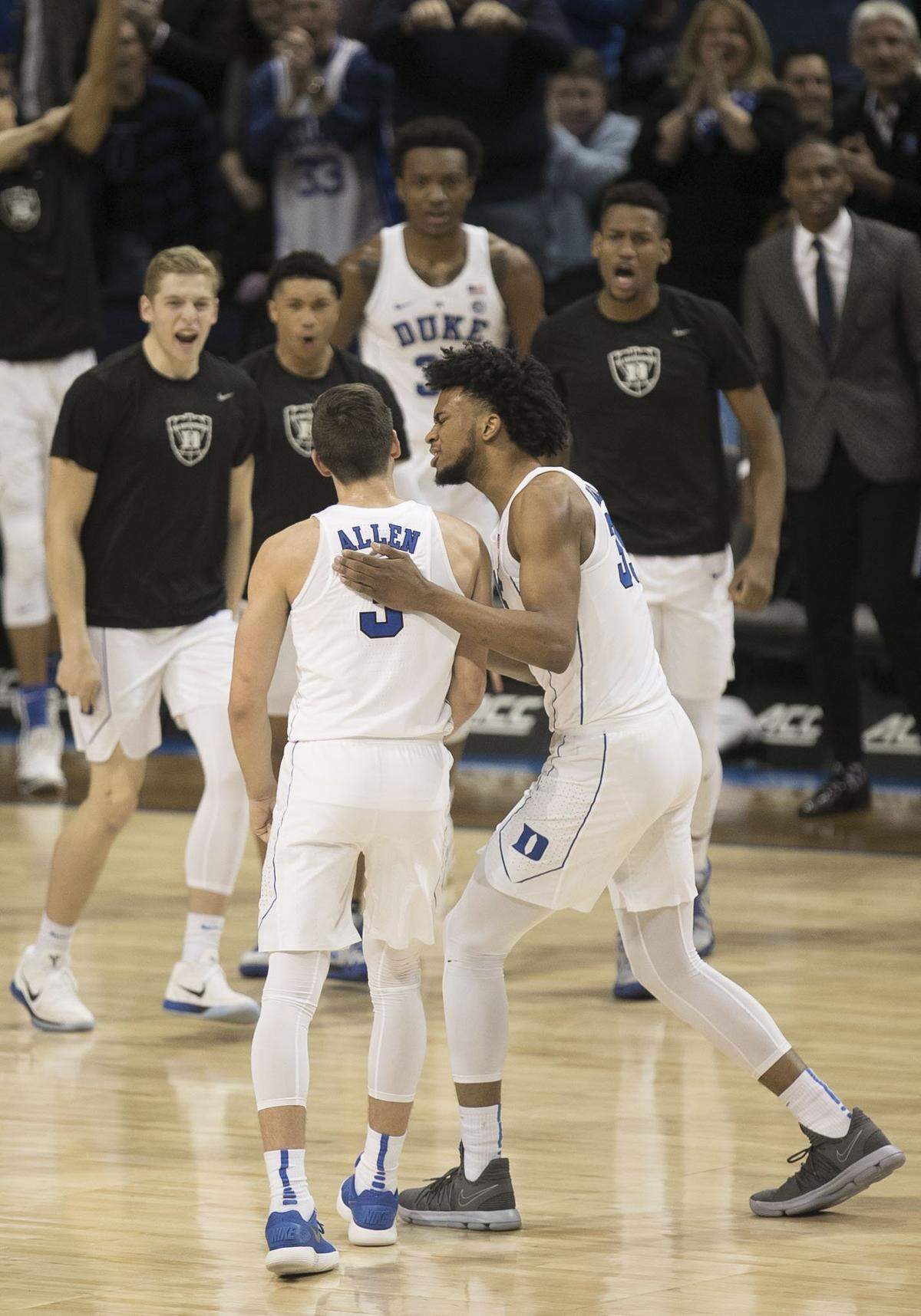 Duke's Marvin Bagley III (35) greets Grayson Allen (3) as they head to the bench during a time out after Allen hit a three point shot in the first half during the quarterfinals of the ACC Tournament.
