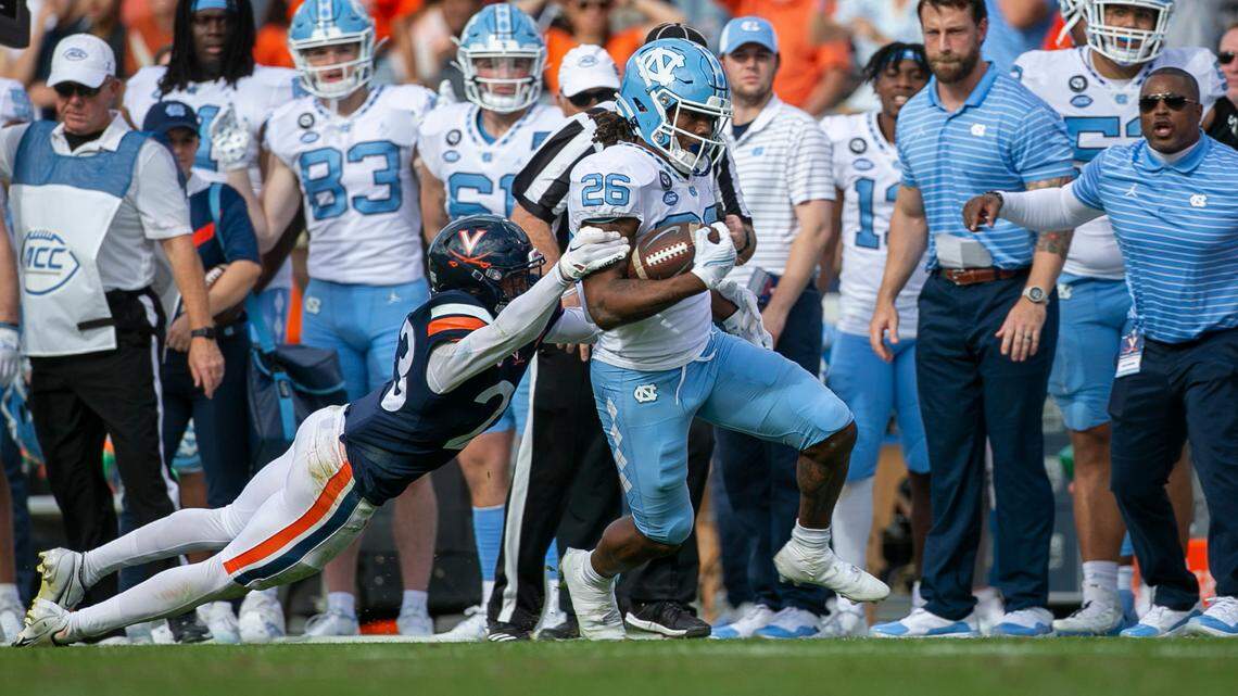 Virginia’s Fentrell Cypress II (23) works to stop North Carolina’s D. J. Jones (26) after a 14-yard pass reception from quarterback Drake Maye on Saturday, November 5, 2022 at Scott Stadium in Charlottesville, Va. Jones has moved to the safety position for the 2023 season.