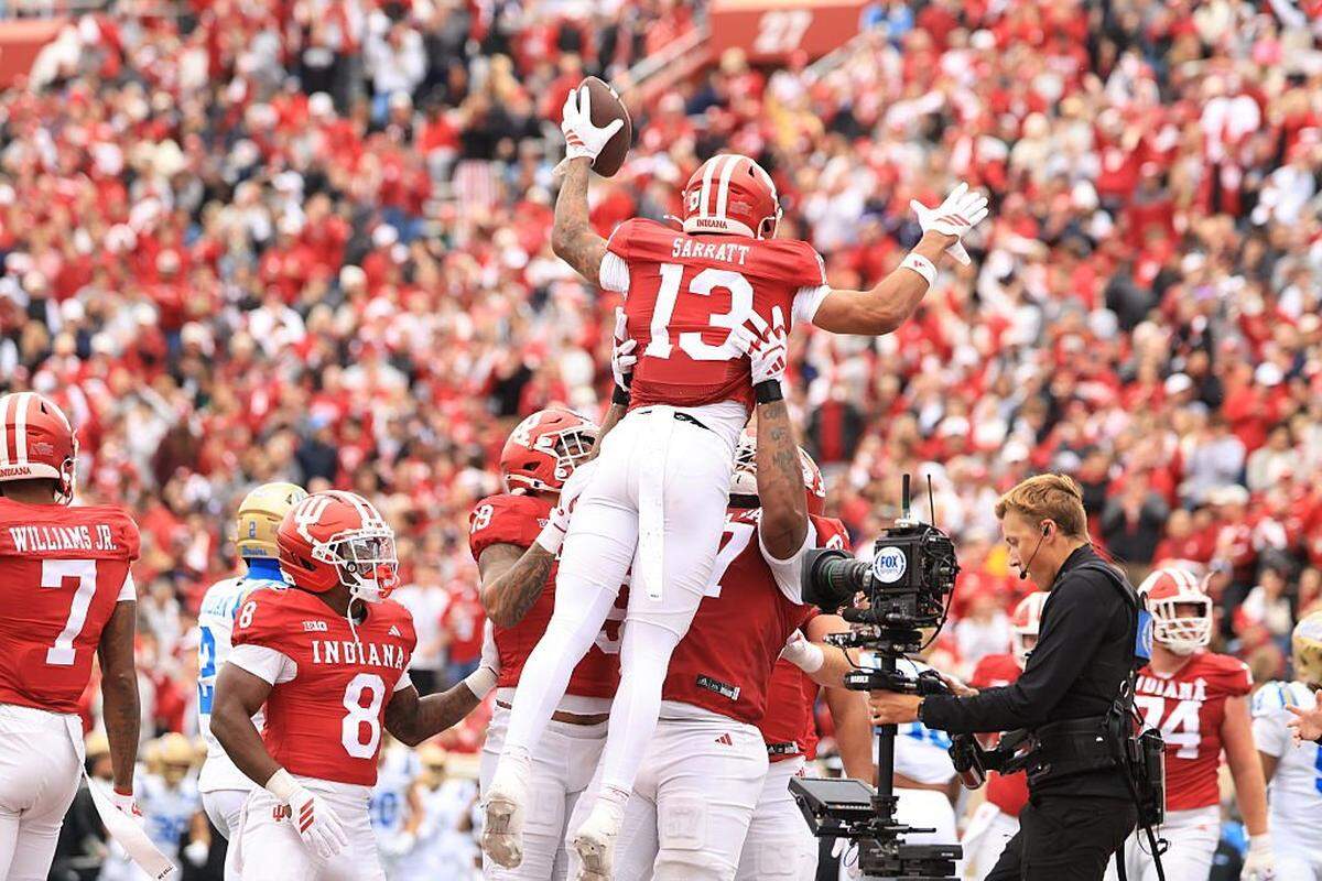 Elijah Sarratt (13) of the Indiana Hoosiers celebrates a touchdown in the second quarter against the UCLA Bruins at Memorial Stadium on Oct. 25, 2025 in Bloomington, Indiana.