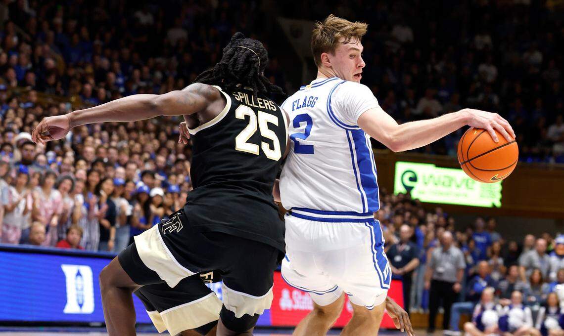 Duke’s Cooper Flagg (2) spins around Wake Forest’s Tre’Von Spillers (25) on his way to the basket during the second half of Duke’s 93-60 victory over Wake Forest at Cameron Indoor Stadium in Durham, N.C., Monday, March 3, 2025.