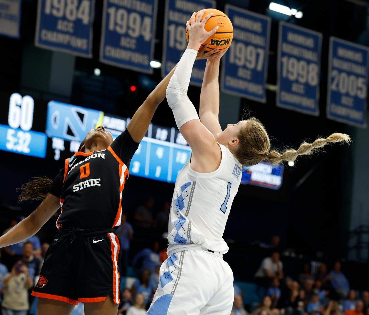 North Carolina’s Alyssa Ustby (1) grabs an offensive rebound from Oregon State’s Tiara Bolden (0) during their victory over Oregon State in the first round of the NCAA women’s basketball tournament at Carmichael Arena in Chapel Hill Saturday, March 22, 2025. The rebound made Ustby the leading rebounder in North Carolina women’s basketball history.