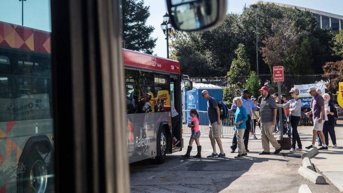 Fair-goers board a GoRaleigh N.C. State Fair Park and Ride Shuttle Monday October 17, 2016 at the North Carolina State Fair. GoRaleigh provides daily service to the State Fair operating from three locations. All passengers are dropped off at Gate 1 of the State Fairgrounds.