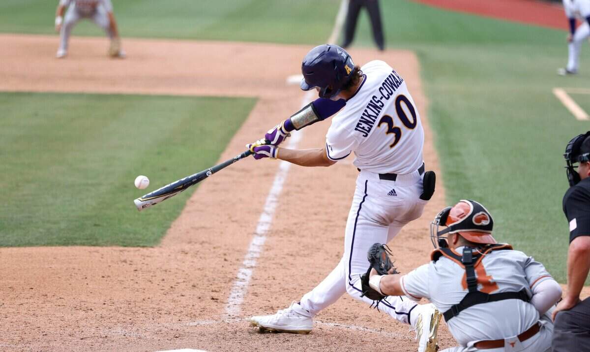 East Carolina’s Jacob Jenkins-Cowart (30) connects on a RBI double in the eighth inning during ECUs 13-7 victory over Texas in the Greenville Super Regional at Clark-LeClair Stadium Friday, June 10, 2022.