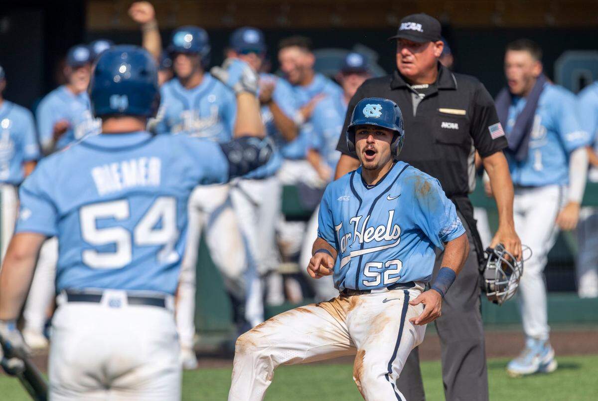 North Carolinas Tomas Frick (52) scores on a wild pitch by Arkansas pitcher Brady Tygart (25) in the seventh inning to tie Arkansas 2-2 in game two of their NCAA Super Regional series on Sunday, June 12, 2022 at Boshamer Stadium in Chapel Hill, N.C.