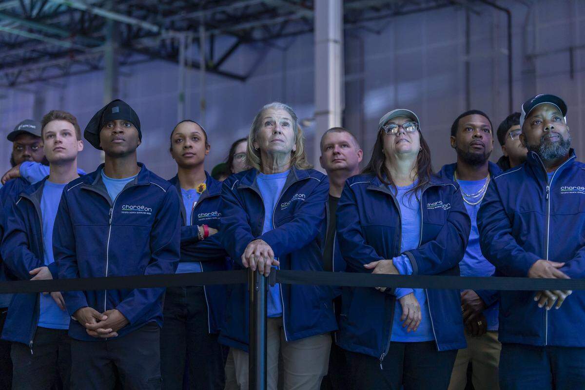 Toyota employees, including Karon Little, center, of Asheboro, N.C., listen to remarks by North Carolina Gov. Josh Stein, during a celebration of the start of production at Toyota’s massive $13.9 billion battery plant in Liberty, N.C. on Wednesday.