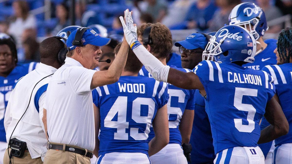 Duke Head Coach David Cutcliffe, left, high-fives Jalon Calhoun (5) during the second half of an NCAA football game against Kansas in Durham, N.C., Saturday, September 25, 2021.