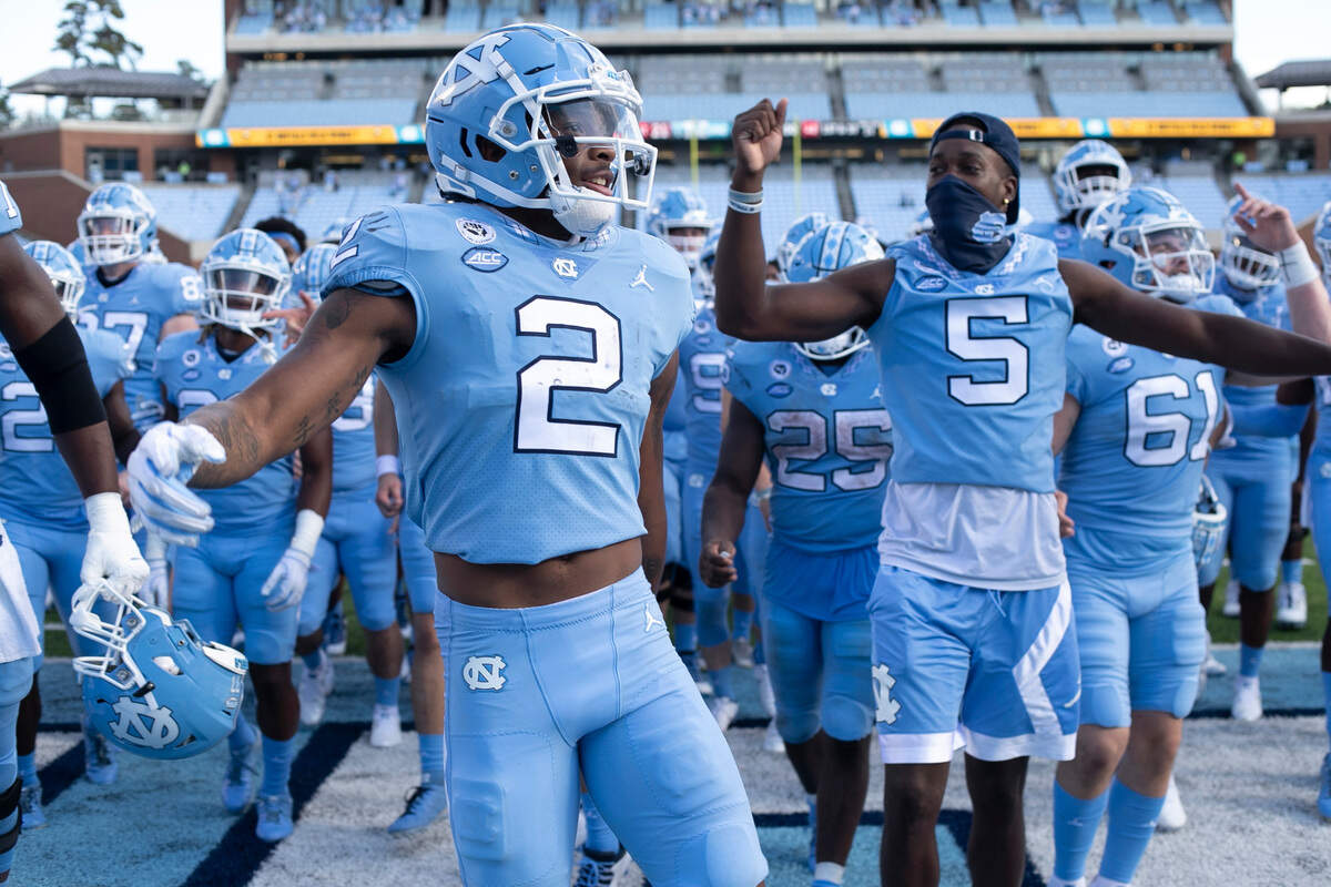 North Carolina’s Dyami Brown (2) celebrates with his teammates following the Tar Heels’ 48-21 victory over N.C. State at Kenan Stadium on Saturday, October 24, 2020 in Chapel Hill, N.C.